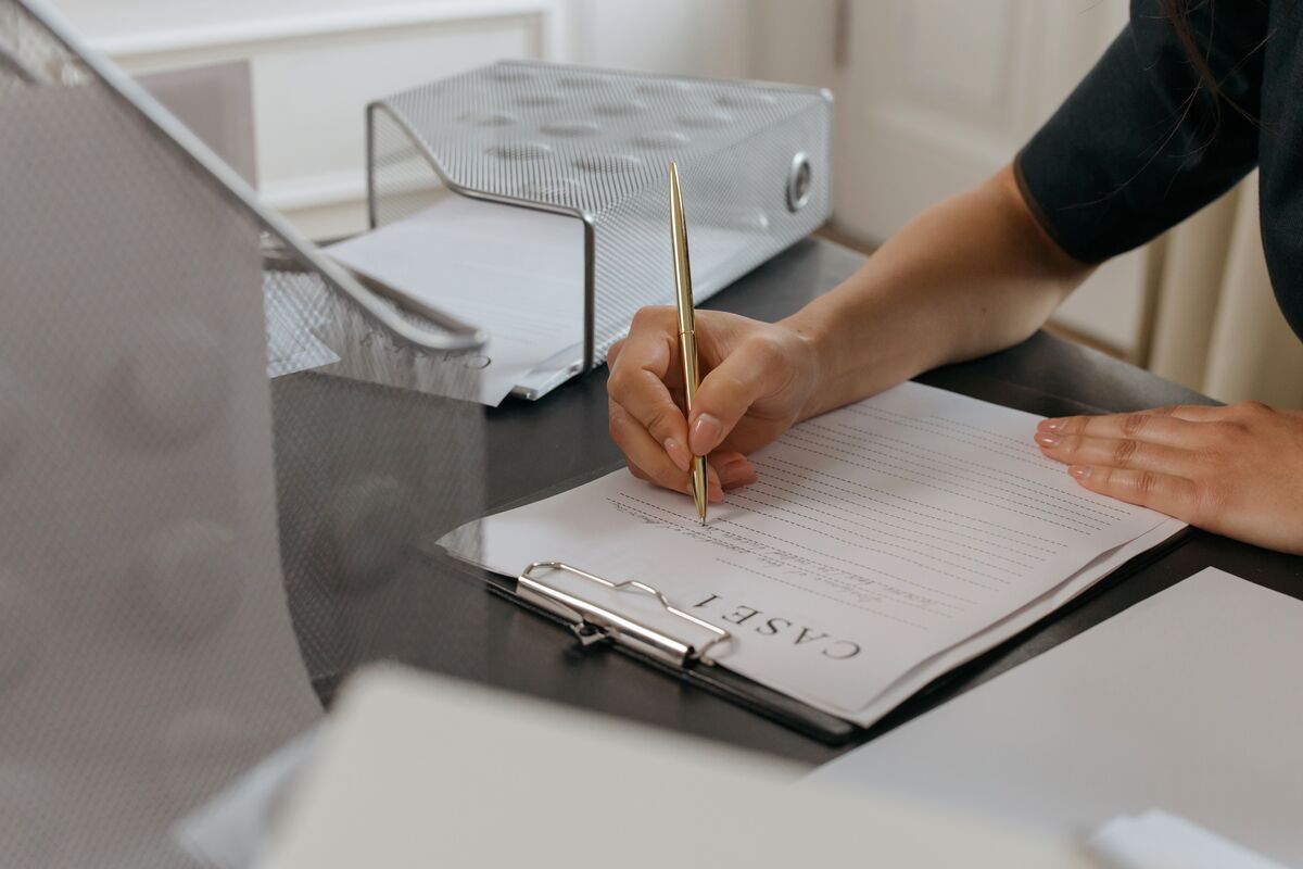Person preparing legal documents for a Special Immigrant Juvenile Status Form I-360 petition