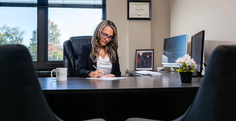 Managing attorney reviewing documents in the J Kelley Law Group office, representing clear legal guidance for personal injury clients in Maryland.