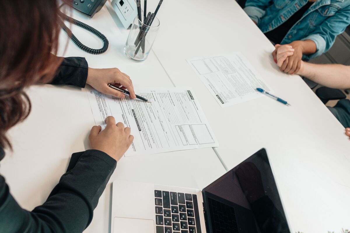 Legal professional reviewing immigration forms with a client during a U Visa consultation