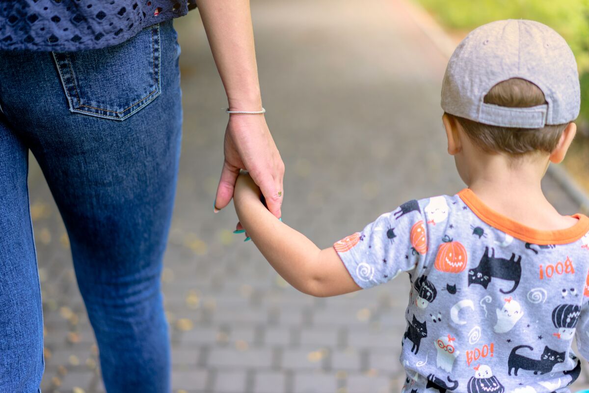 Parent holding a child’s hand, representing child support guidance for Maryland families with J Kelley Law Group