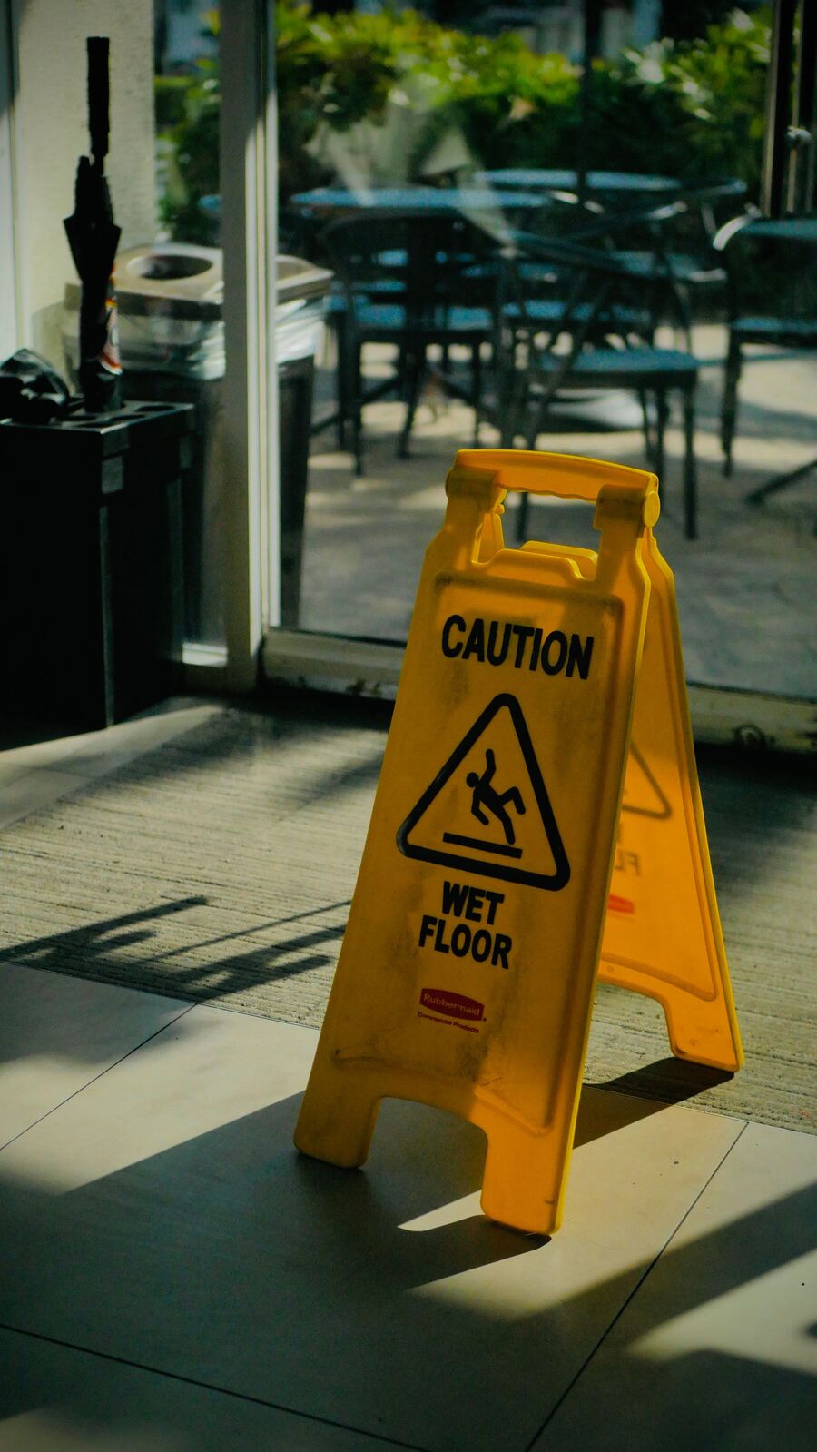 Wet floor warning sign in a commercial property for a Maryland slip and fall accident claim